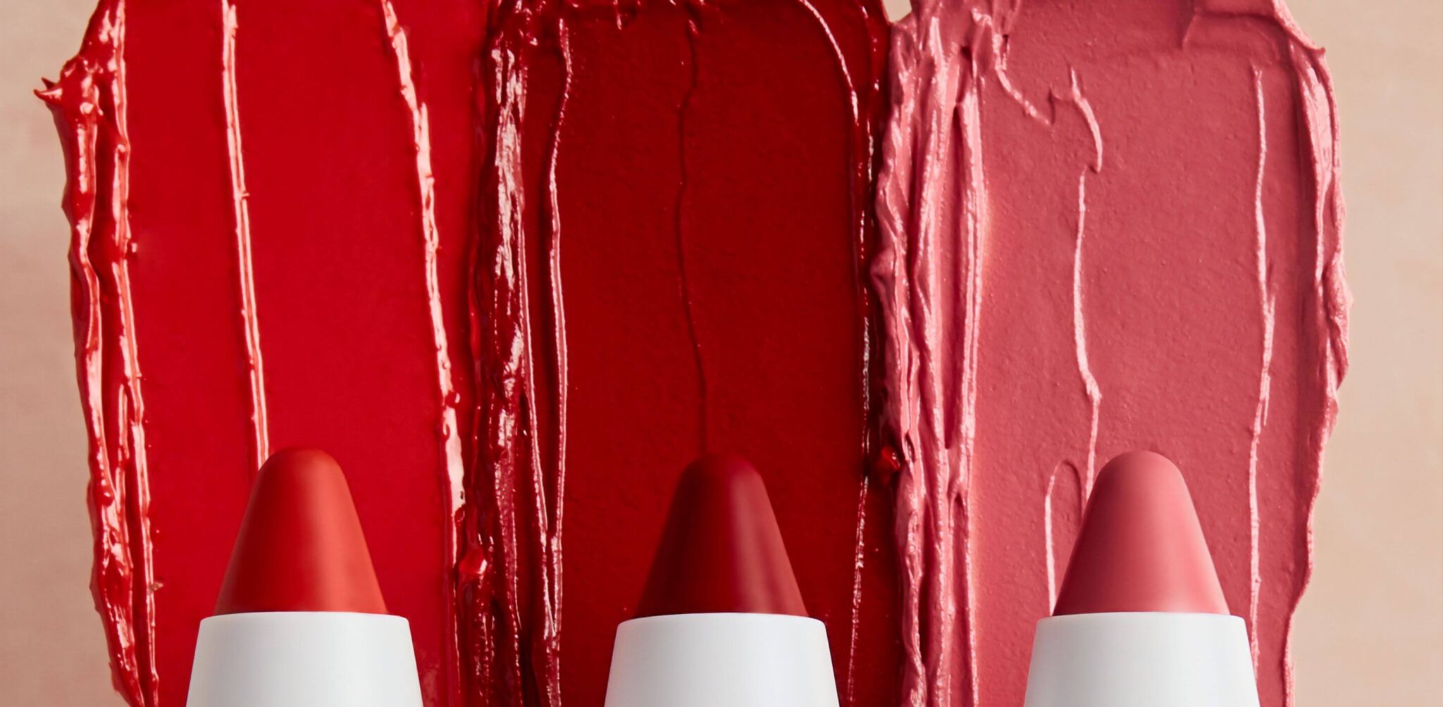 Three colours of lipstick are side by side.