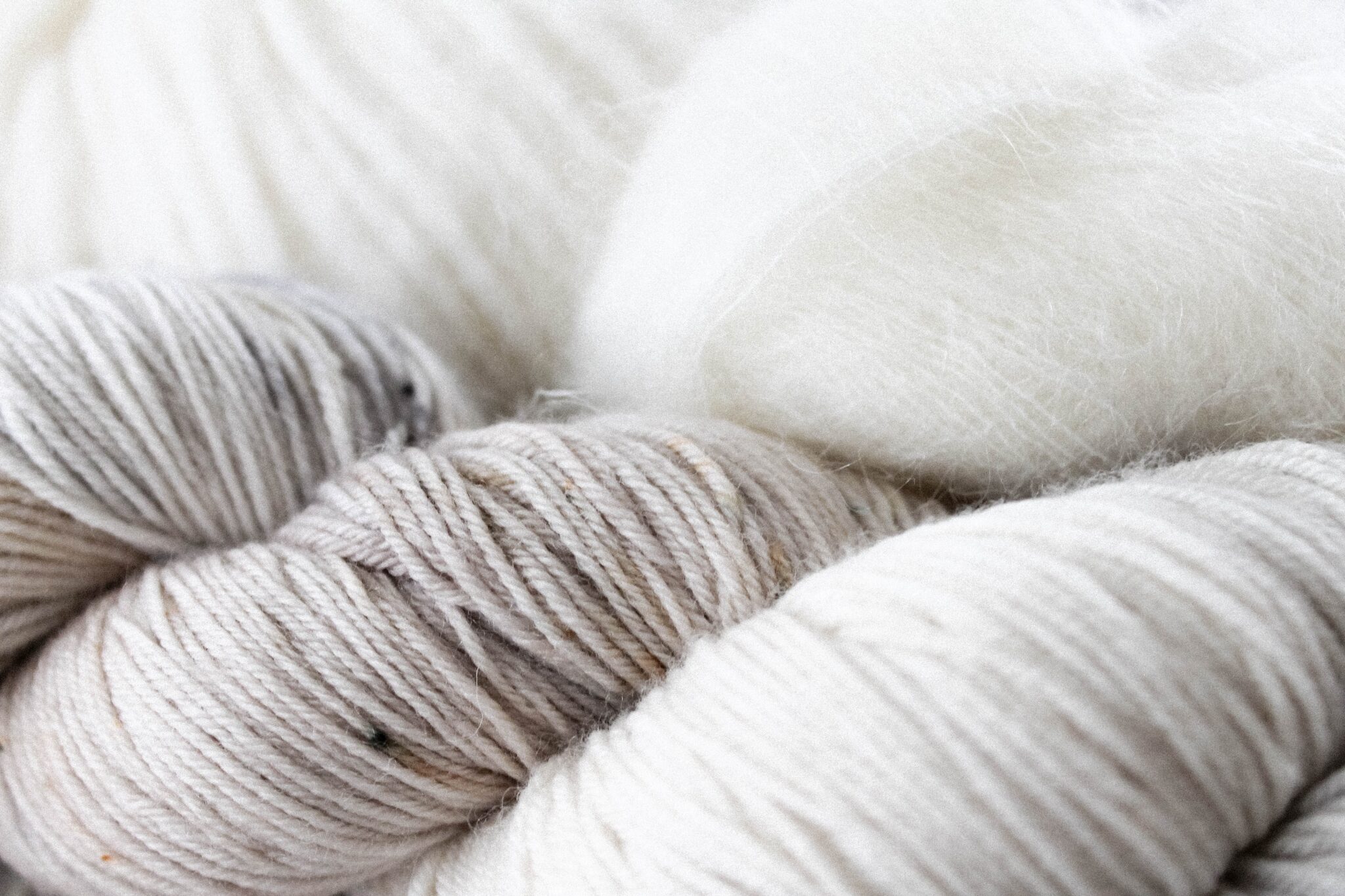 White and grey yarn and wool.