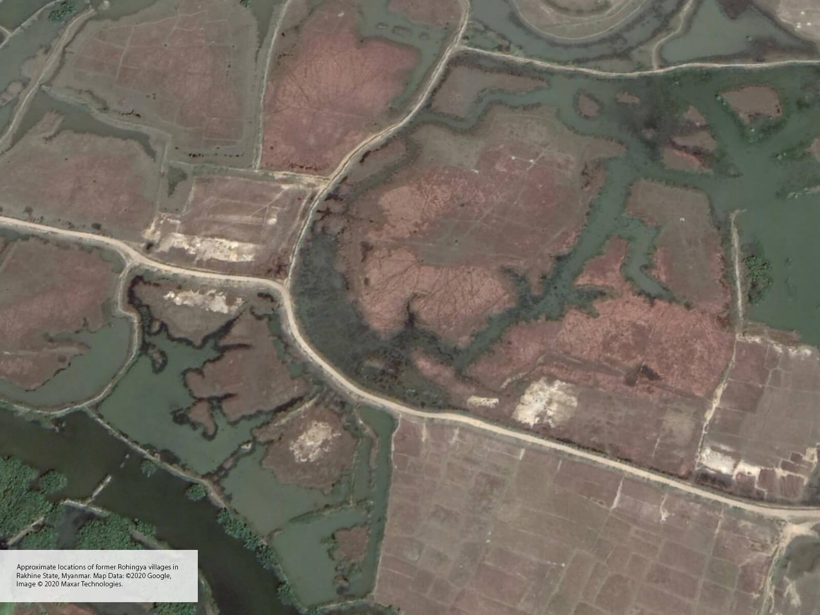 Satellite image of fields and roads and what seems to be demolished buildings