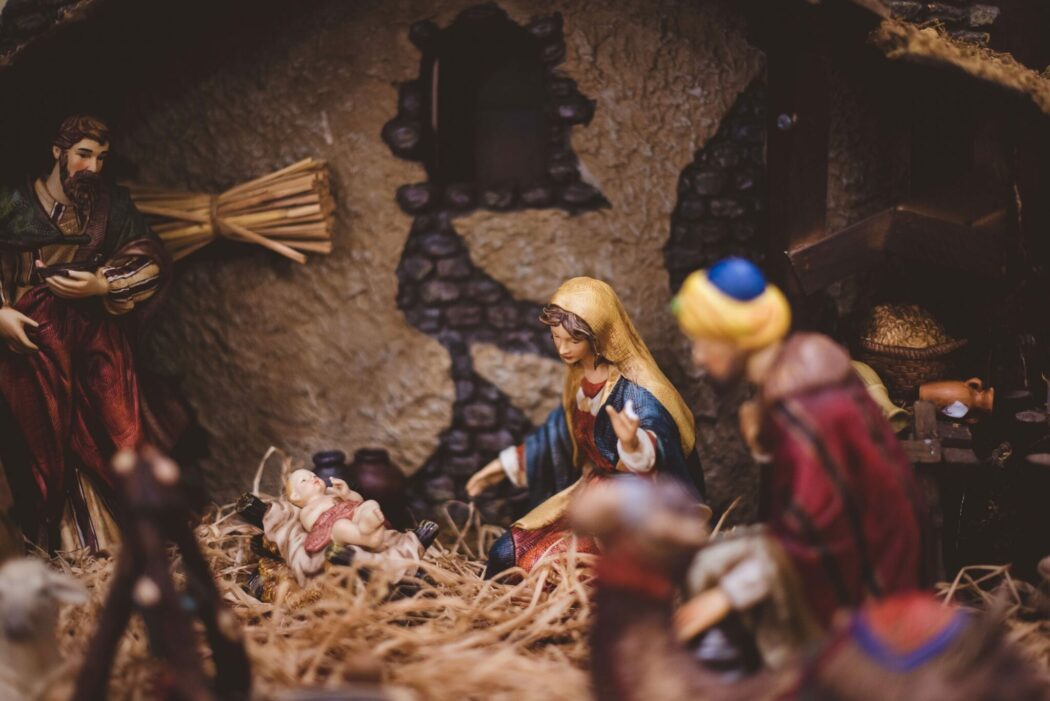 A close up photo of a porcelain nativity scene where Mary and baby Jesus are in focus.