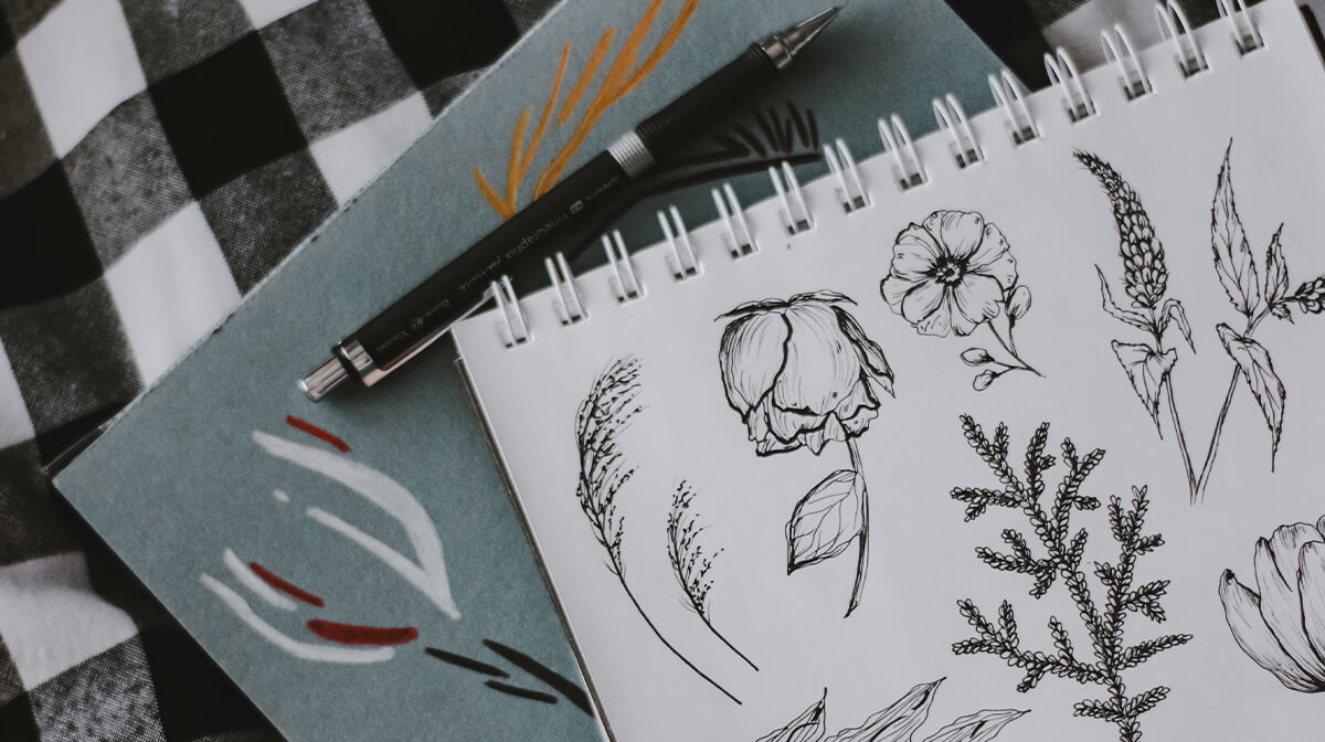 A notebook with floral drawings