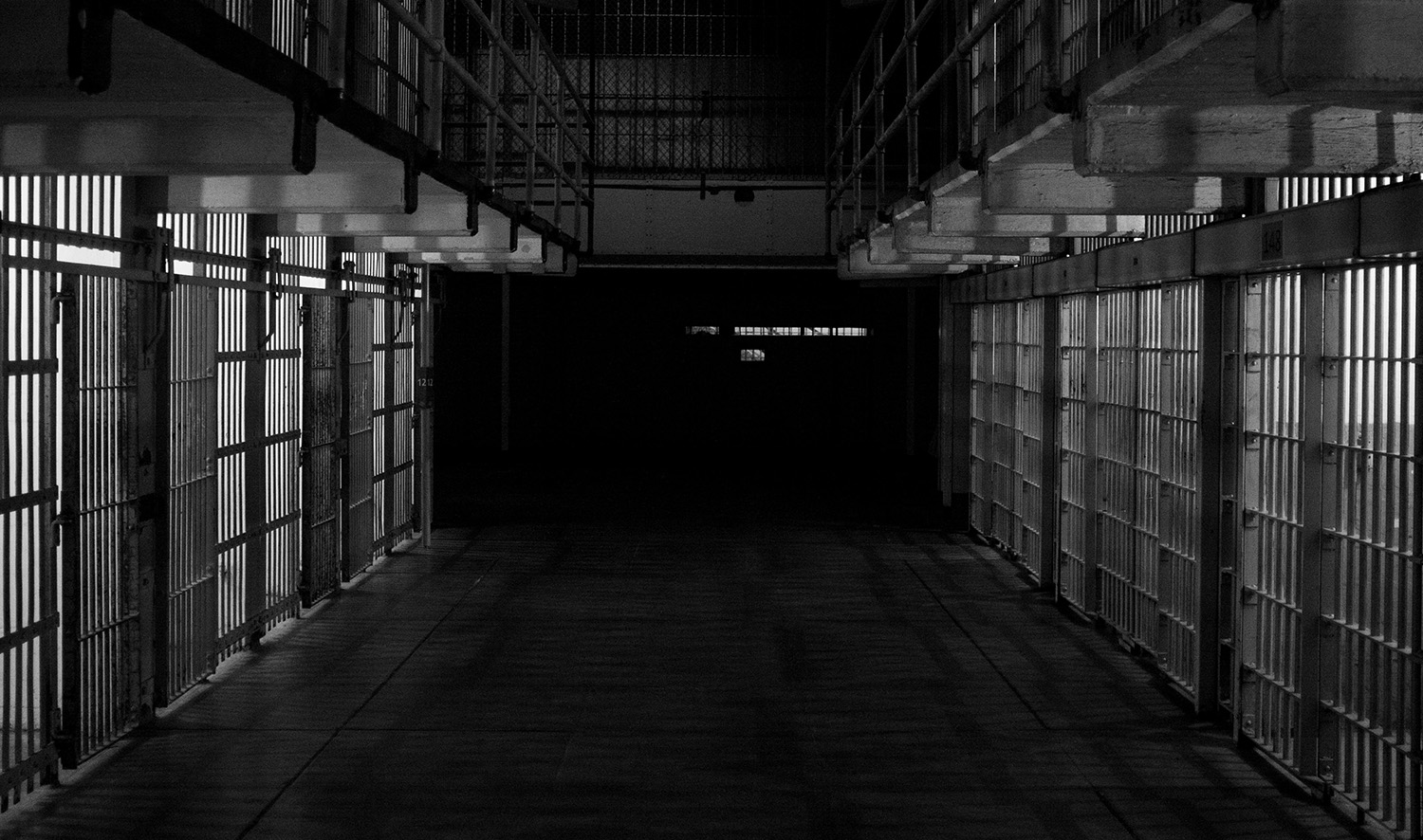A black and white image of prison cells